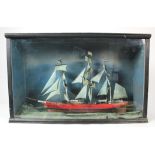 Model of a tall ship with three masts, circa early 20th century, contained in large glass front