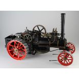 Large Fowler scratch built live steam traction engine, black with red spoke wheels, in need of