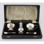 Silver boxed cruet and two silver salt spoons, cruet set marked Birmingham, 1939, spoons