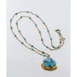 Yellow metal (tests 9ct Gold) Turquoise Pendant on a Turquoise bead 24 inch chain weight