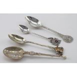 Three silver spoons (various) and a plated Napoleon spoon. The silver items include a London