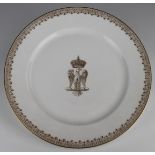 Sevres dinner plate with central gilt armorial depicting a crown above an eagle, gilt border,