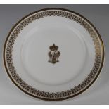 Sevres side plate with central gilt armorial depicting a crown above an eagle, gilt border, circa