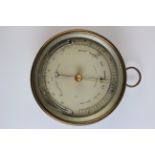 Brass cased aneroid barometer and thermometer, circa early 20th century, case stamped DC with an