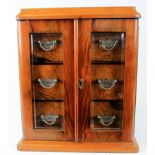 Small walnut three drawer smoking cabinet with bevelled glass fronted doors, circa late 19th to