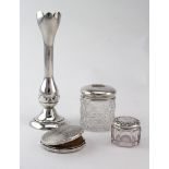 Mixed lot of silver comprising a silver compact, a flower holder and two silver topped glass jars.