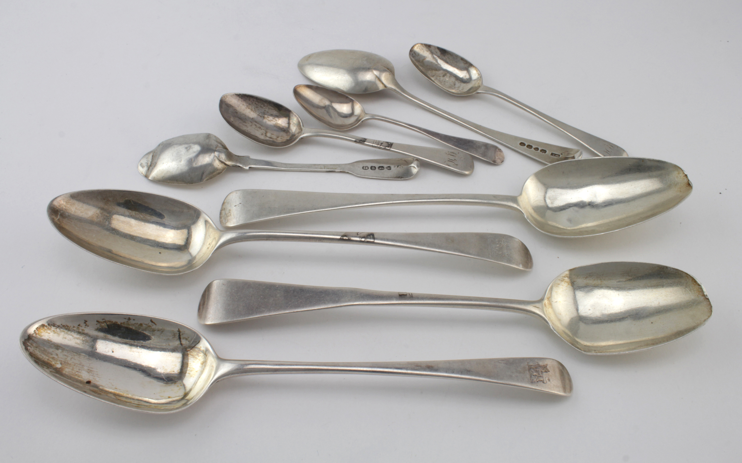 Mixed lot of silver flatware consisting of nine spoons, mixed condition with various Georgian