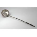 Georgian Scottish white metal ladle, twisted horn handle, with a George II silver shilling (1758)