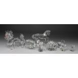 Swarovski Crystal. Eight pieces of Swarovski Crystal, comprising a dragon, cat, clam shell, two