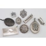 Collection of six silver pendants, two silver brooches – (one marked St. Helena) and one silver fob.