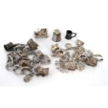 Two silver charm bracelets plus three silver charms and one silver thimble. Gross weight of all