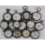 Fourteen silver open face pocket watches, small to mid size types.