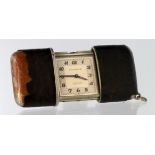 Movado "Chronometre Ermeto" slide action travel clock within a crocodile skin covered case, the