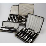 Four boxes of silver flatware comprising two sets of six pastry forks, six teaspoons and a small