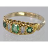 Yellow Metal (tests 10ct) Emerald and Opal Ring weight 2.0g