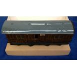 Toy, a tinplate Railway carriage, G.N.R. Guards/Brake van, (Carette for Bassett-Lowke) (some