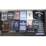 Playing cards, a quantity of modern playing card packs, many unopened, mostly with alcohol