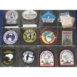 Exploration, a collection of 25 embroidered cloth badges for various expeditions, mostly QUARK,