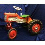 Toys, Tri-ang Pedal Tractor, 1960s issue with plastic moulded body, metal seat and hubs, retaining