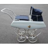 Tri-ang 1960s Dolls Pram, finished in white with floral decal, white interior blue fabric hood and