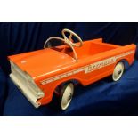 Tri-ang Bermuda Pedal Car, orange pressed steel construction with original inner packing,