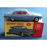 A Dinky Toys 142 Jaguar Mark X, metallic blue body, red interior, spun hubs, with luggage, in