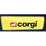 Corgi Toys Shop Display Sign, yellow moulded plastic sign with hanging holes, approx 495mm in