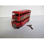 A Tri-ang Minic 60M Double Decker Bus, red tinplate body clockwork motor, black plastic hubs, '14