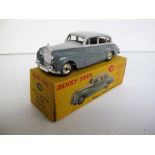 A Dinky Toys 150 Rolls-Royce Silver Wraith, two-tone grey body, spun hubs, in original box (near