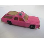 A Matchbox Speed Kings Pre-Production Dodge Monaco Estate, fluorescent pink body, brown plastic roof