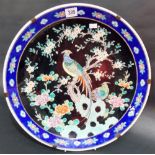 Chinese famille noir charger decorated with two exotic birds amongst prunus and chrysanthemum,