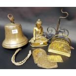 Collection of brass including a bell with wrought iron bracket, an Eastern seated Buddha figure,