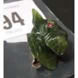 Good Art Deco nephrite terrior dog head, 935 silver mounted clip, the carved head with ruby cabochon