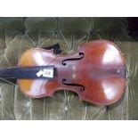 A Stradivarius copy violin, the two piece medium curl 14' back with stamped button together with two