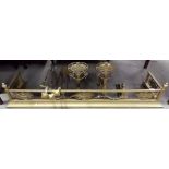 George III style brass fender and andirons decorated with oval pierced and cast panels and ribbon