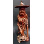 Chinese root carved figure of a jovial sage wearing circular hat, height 16'.