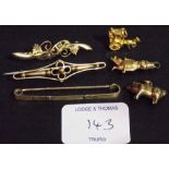 Three 9ct bar brooches; together with three 9ct gold charms (6).