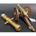 Miniature Georgian style brass cannon upon berth; together with a brass lacquered cannon (2).
