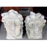 Pair of reconstituted stone architectural head carvings.