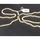 Double row string of pearls with 14k gold pearl set clasp, length 20' approx