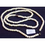 Two antique ivory bead necklaces.