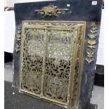 Interesting Georgian brass and steel back fire surround with foliate scroll pierced hinged guards,