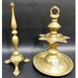 Eastern brass turned stand; together with another brass stand on triple feet (2)