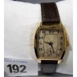 1920's Omega gentlemans 18ct gold manual wind wristwatch, the silver dial with arabic numerals &