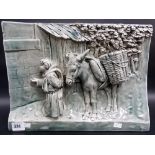 Delphin Massier Vallauris Pottery relief moulded rectangular wall plaque, decorated with a young