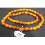 Amber butterscotch oval bead necklace, each bead of various size and colour, weight 83g approx.