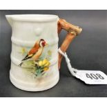 Royal Worcester cream jug painted with a goldfinch, signed W Powell.