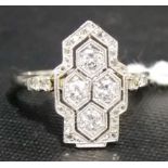 Art Deco platinum diamond cluster ring, of geometric form with four brilliant cut diamonds of 0.10