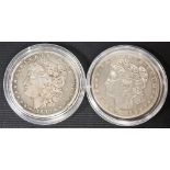 1880 silver dollar together with a 1883 silver dollar (2)