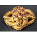 Victorian gold amethyst set brooch, of twisted form and filigree mounted, applied with six